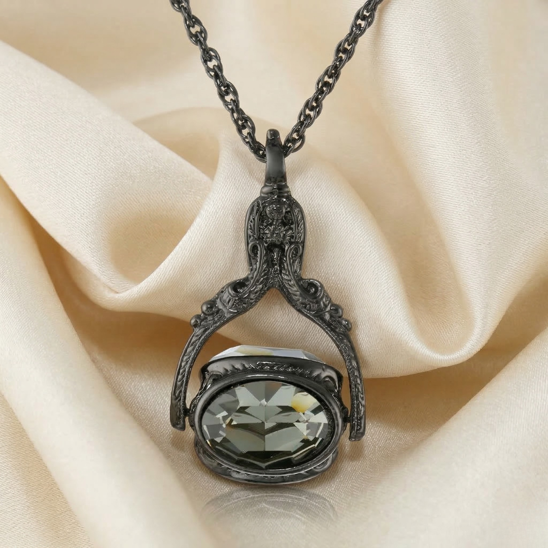 Decorative necklace with a spinner gemstone pendant on a beige fabric background