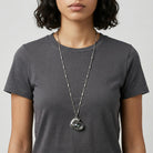 Person wearing a long necklace with a Whimsical Cat & Blue and Green Fish Pendant Necklace