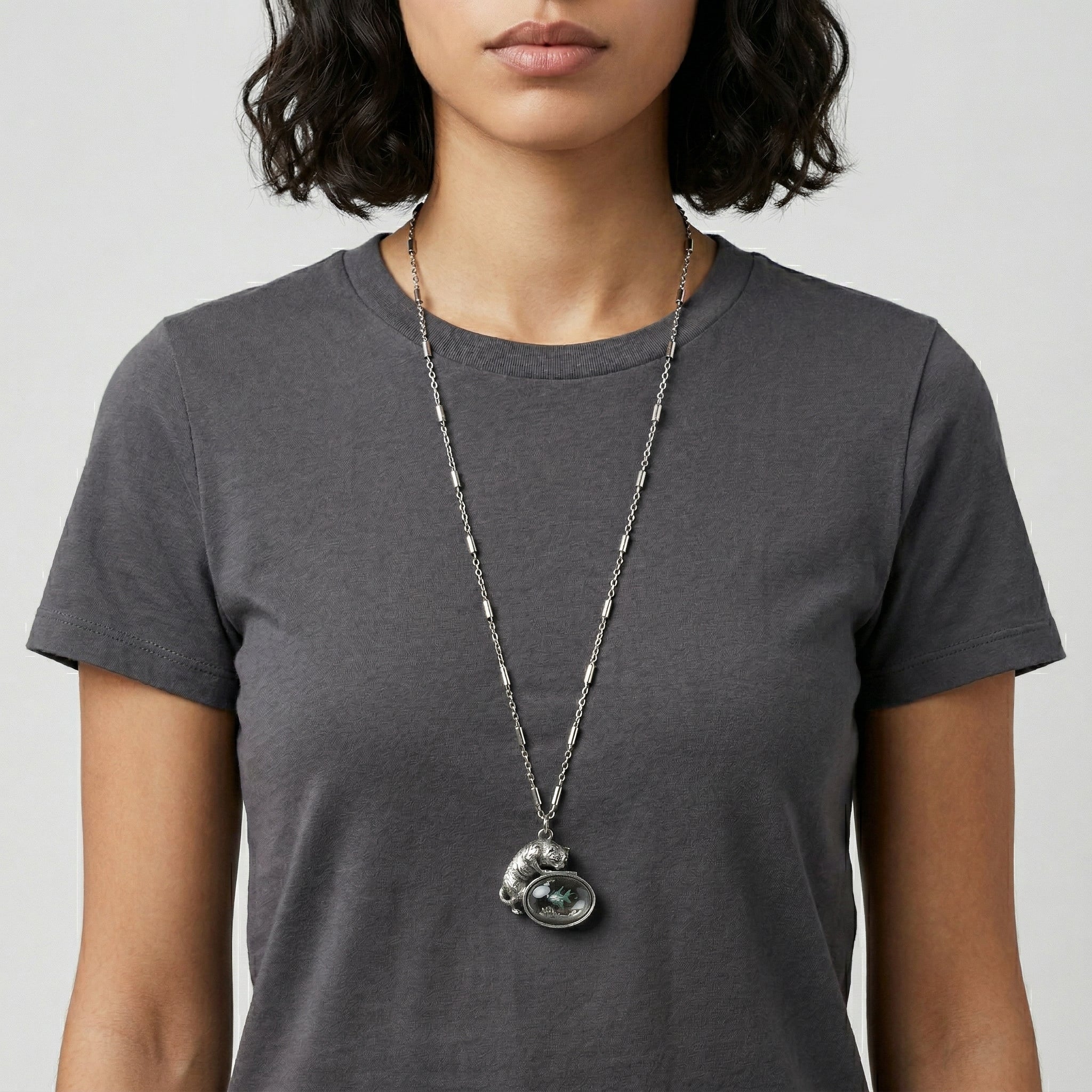 Person wearing a long necklace with a Whimsical Cat & Blue and Green Fish Pendant Necklace