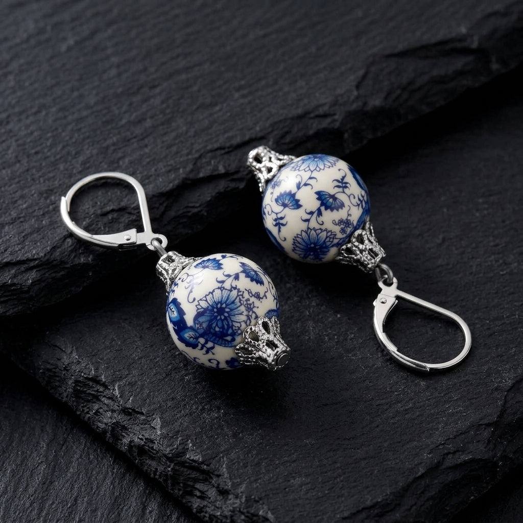 Blue Willow Round Bead Drop Earrings on black stone surface