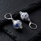 Blue Willow Round Bead Drop Earrings on black stone surface