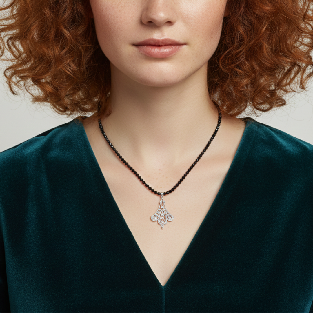 Woman wearing a necklace with a pendant against a neutral background