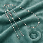 Pewter Round Faux Pearl Cable Chain Eyeglass Holder Necklace on teal fabric