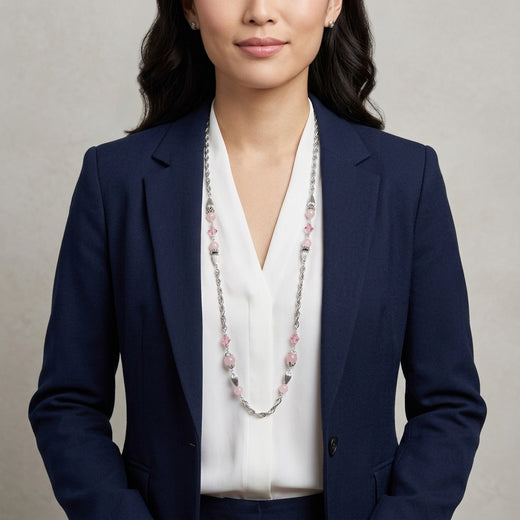 Woman wearing a navy blazer and white blouse with a Roseate Paradise Peppermint Pink Rose Austrian Crystal Beaded Necklace