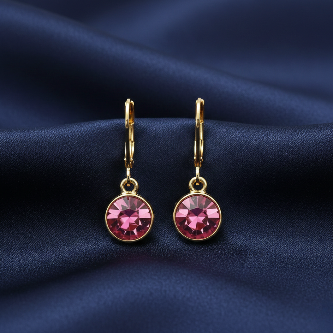 Pink Classic Round Crystal Drop Earrings on blue fabric