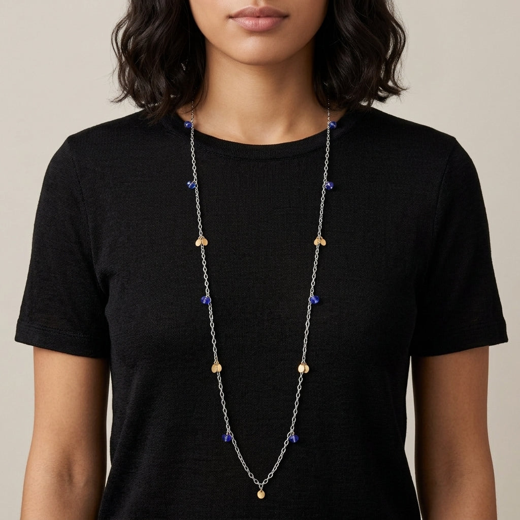 Person wearing a long Faceted Blue Bead & Gold Charms Link Necklace