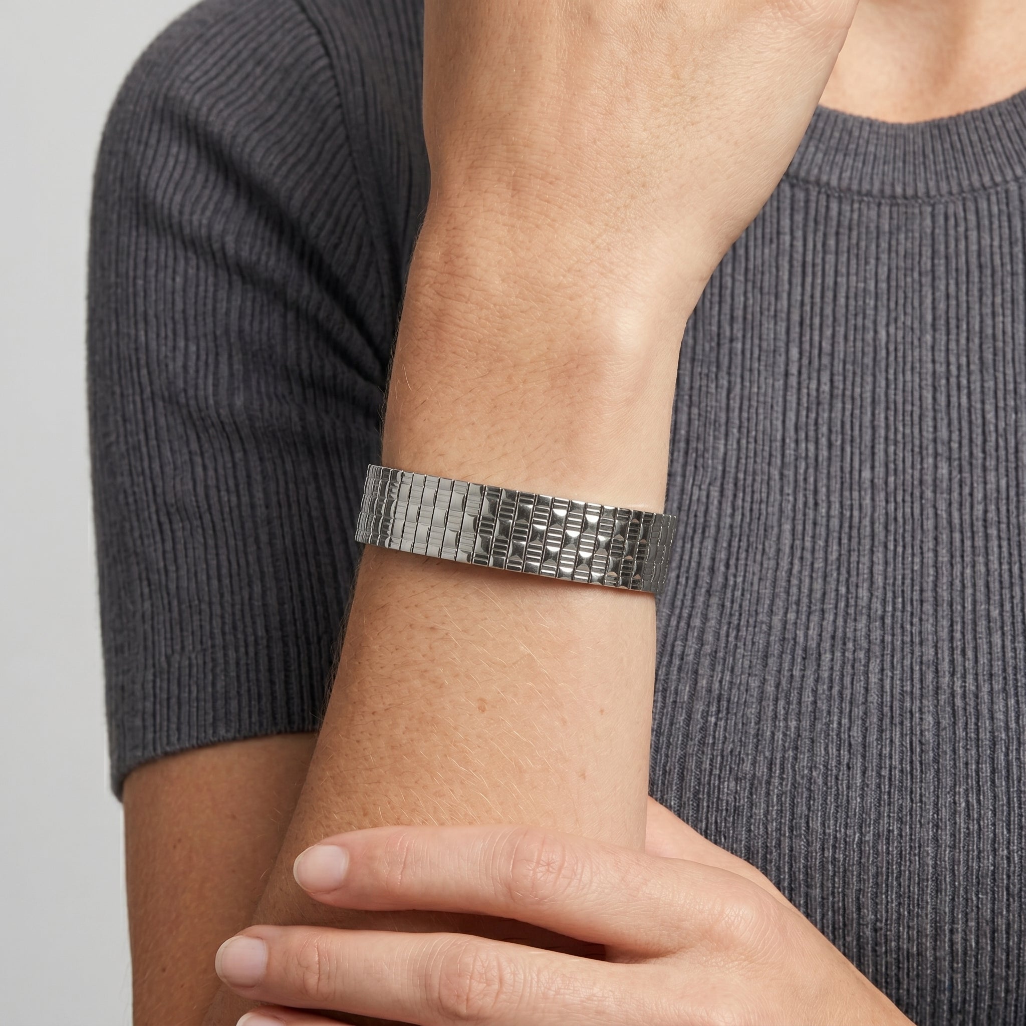 Close up of a woman's wrist wearing a Silver Infinite Stretch Bracelet