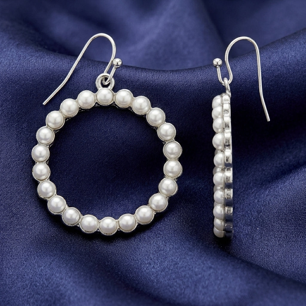 Faux White Pearl Hoop Wire Earrings on dark blue fabric