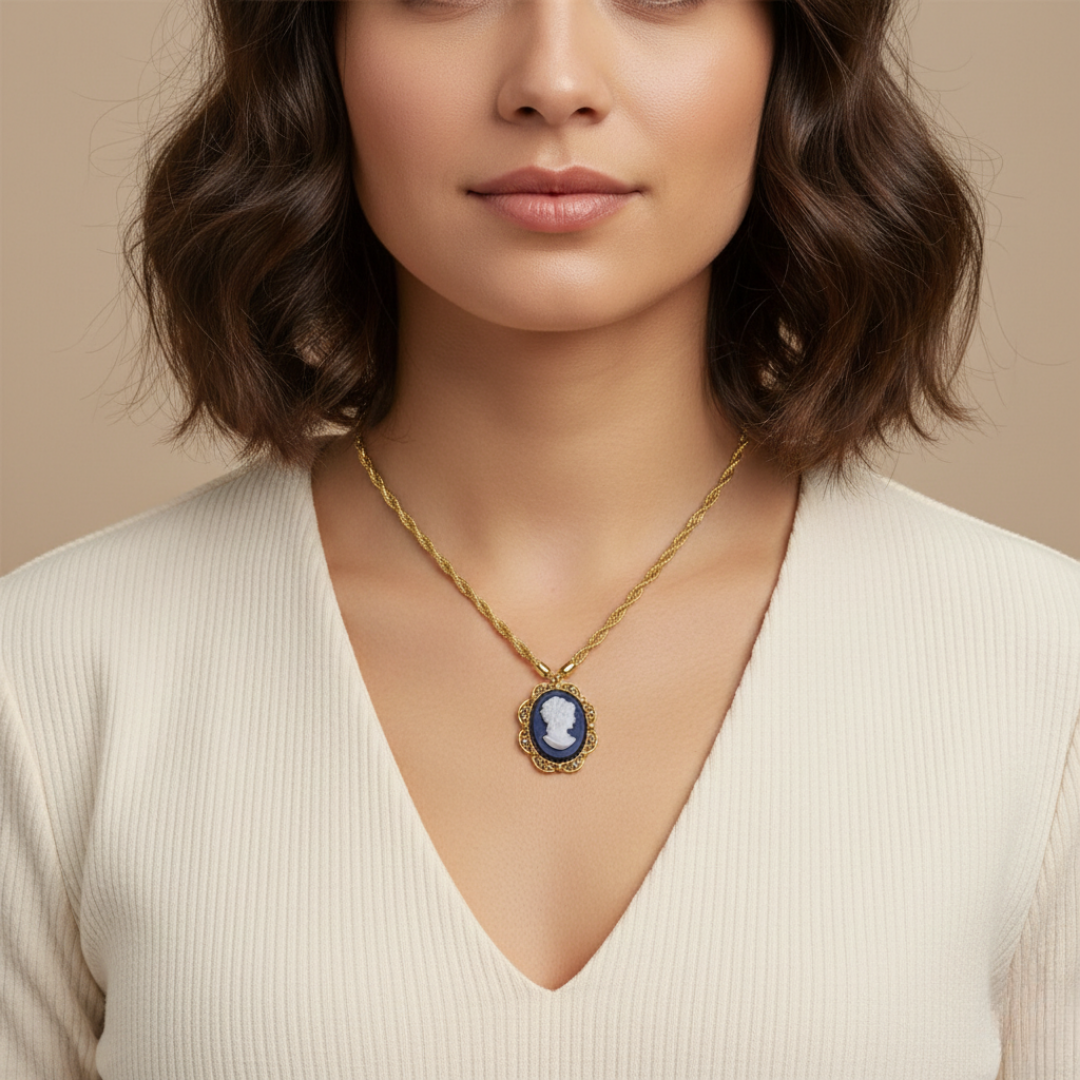 Woman wearing a gold necklace with a blue pendant against a beige background