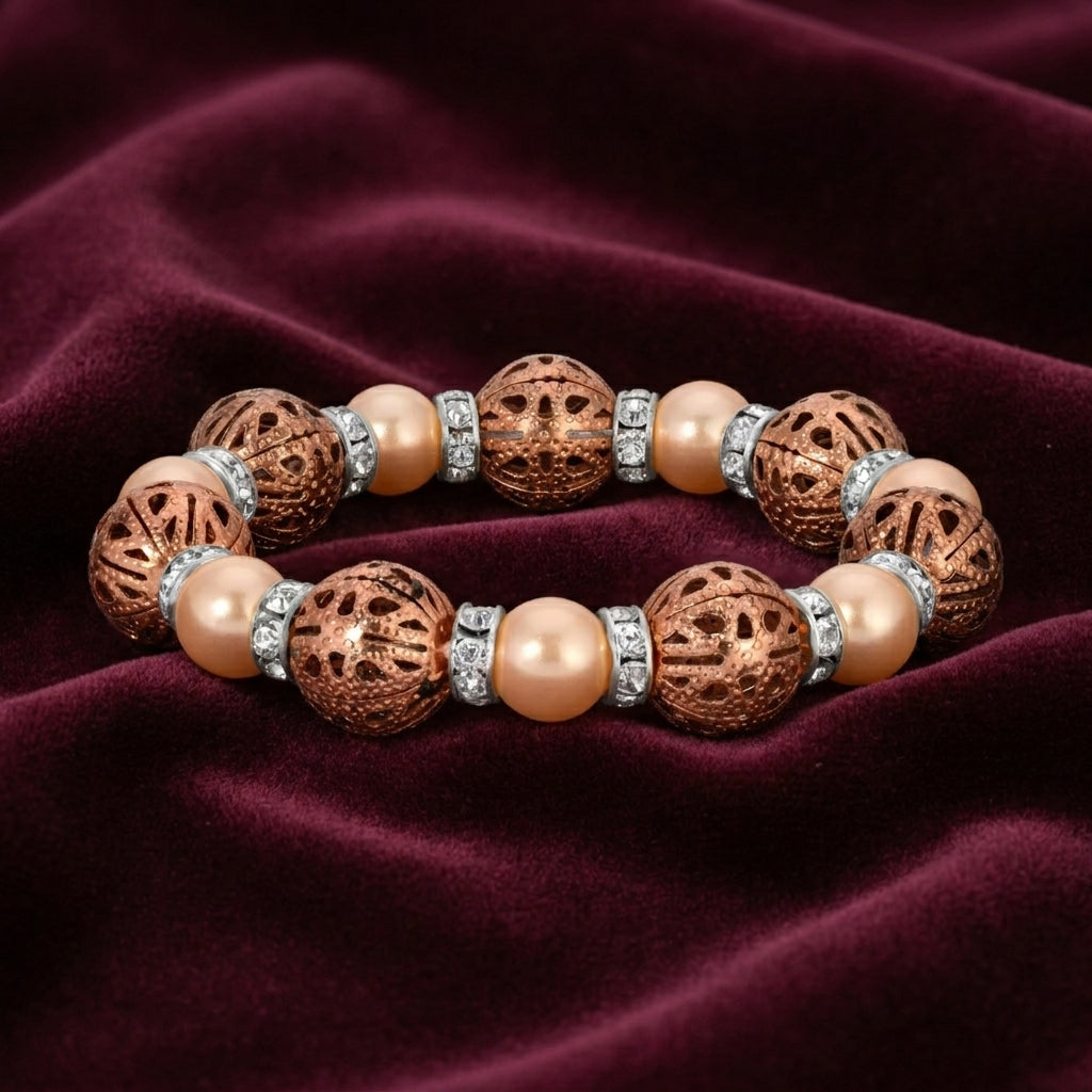 Bracelet with brown and pink beads on a maroon fabric background