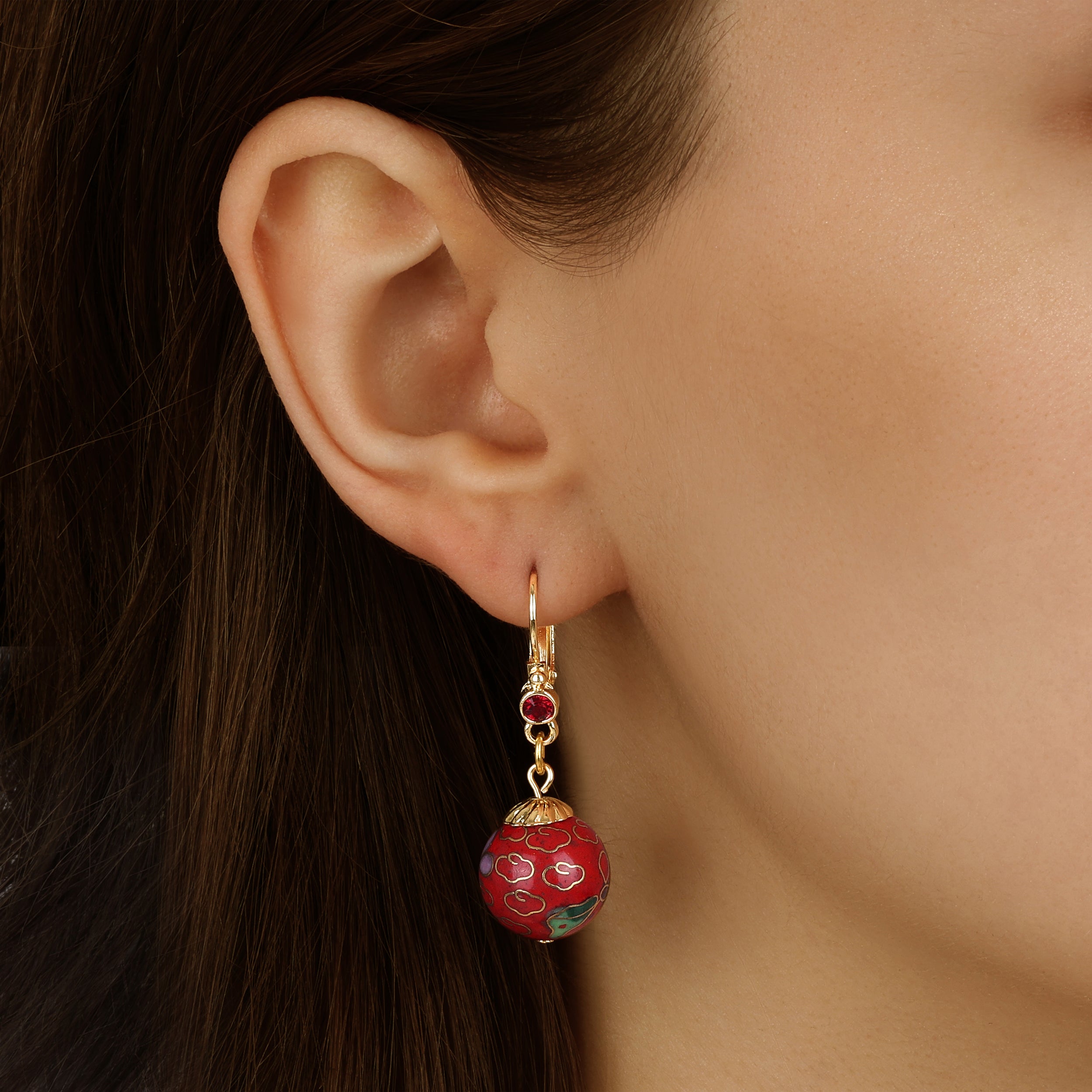 Close up of a model wearing our Red Cloisonnne Enameled Bead & Siam Red European Glass Crystal Leverback Earrings