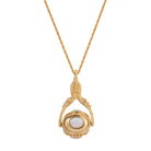 Gold-tone necklace with a multicolor spinner pendant on a white background.
