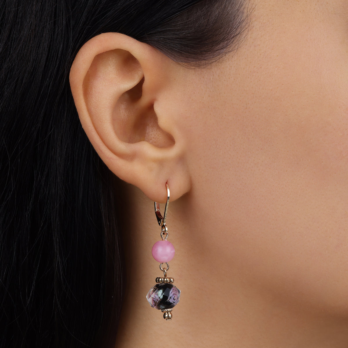 Close up of a woman wearing Rose and Black Floral Bead Dangling Earrings