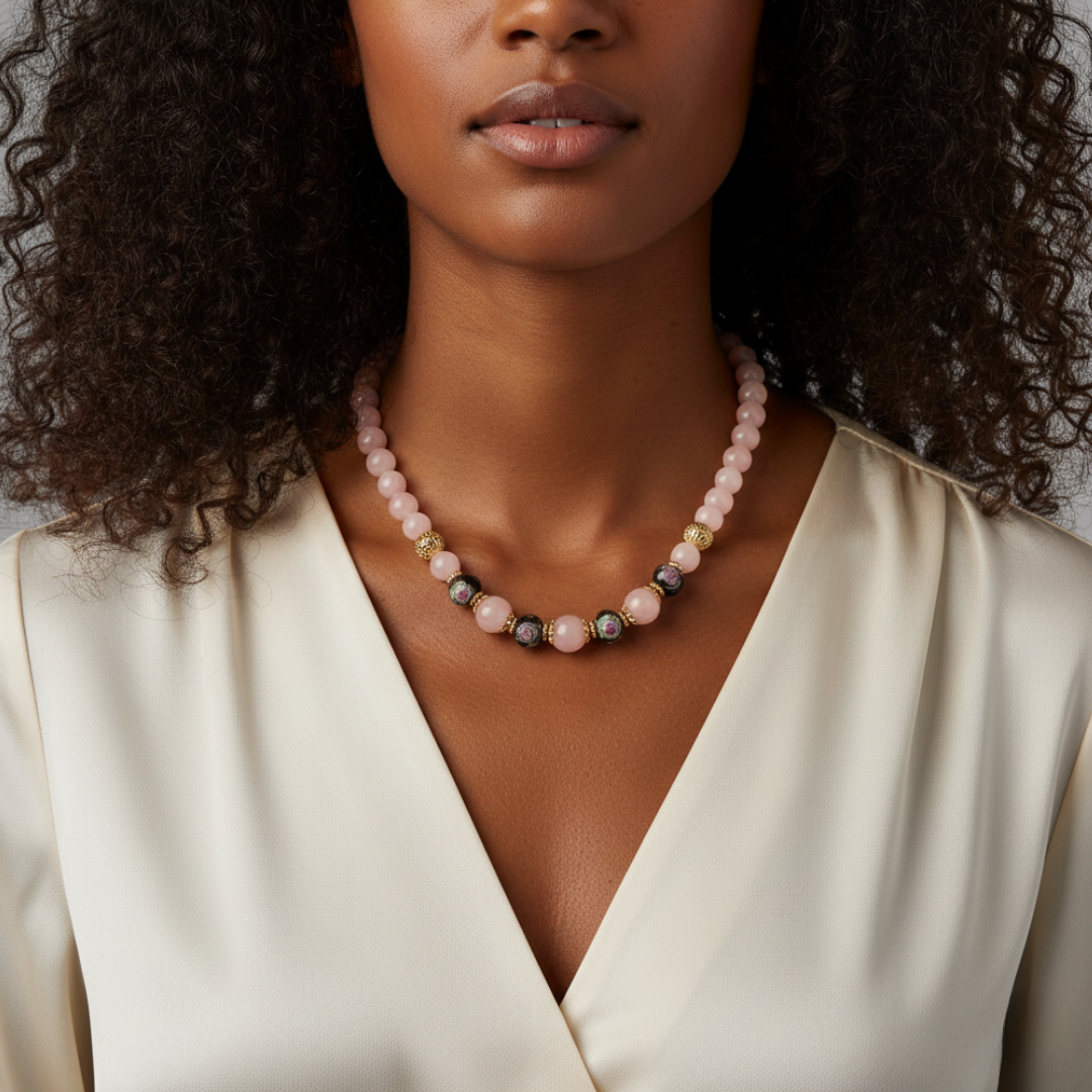 Woman wearing a beaded necklace with a neutral background