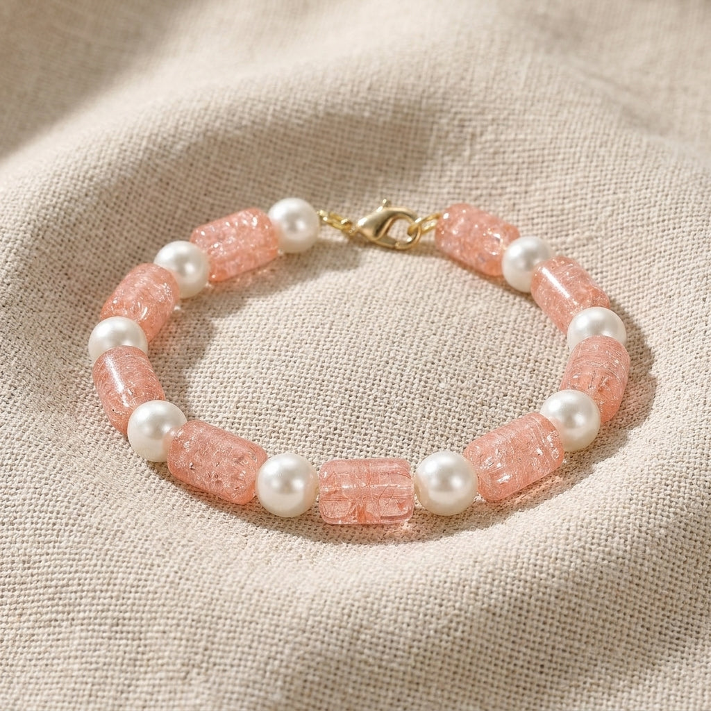 Peach Cracked Glass & White Faux Pearl Beaded Bracelet resting on beige linen