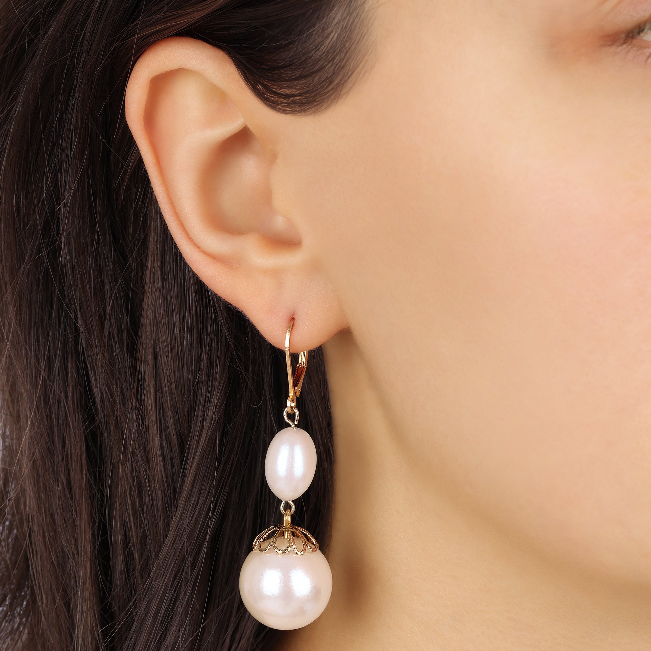 Close up of a female model wearing Gold Faux Pearl Drop & Dangle Earrings