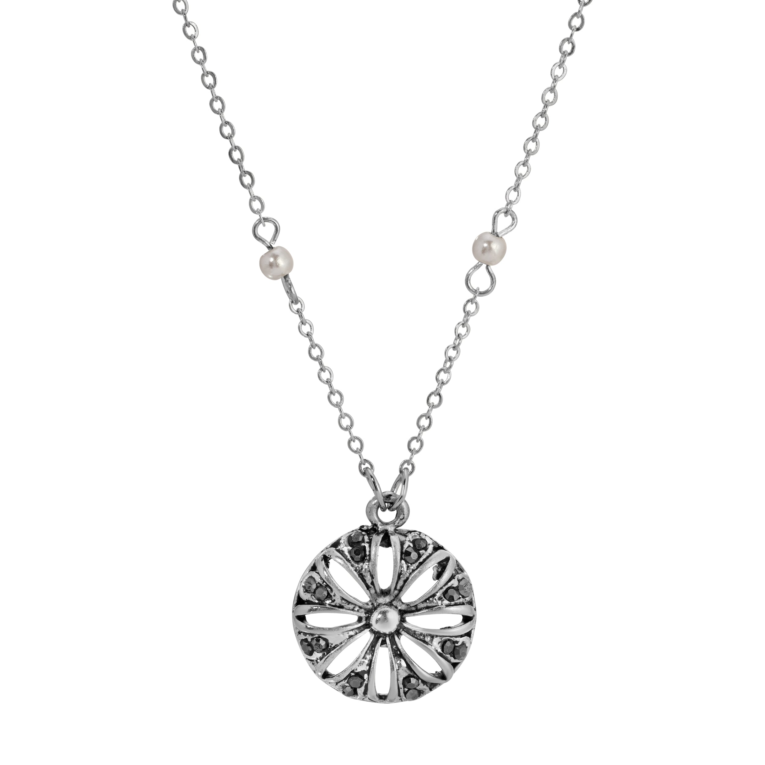Silver necklace with a round floral pendant on a white background