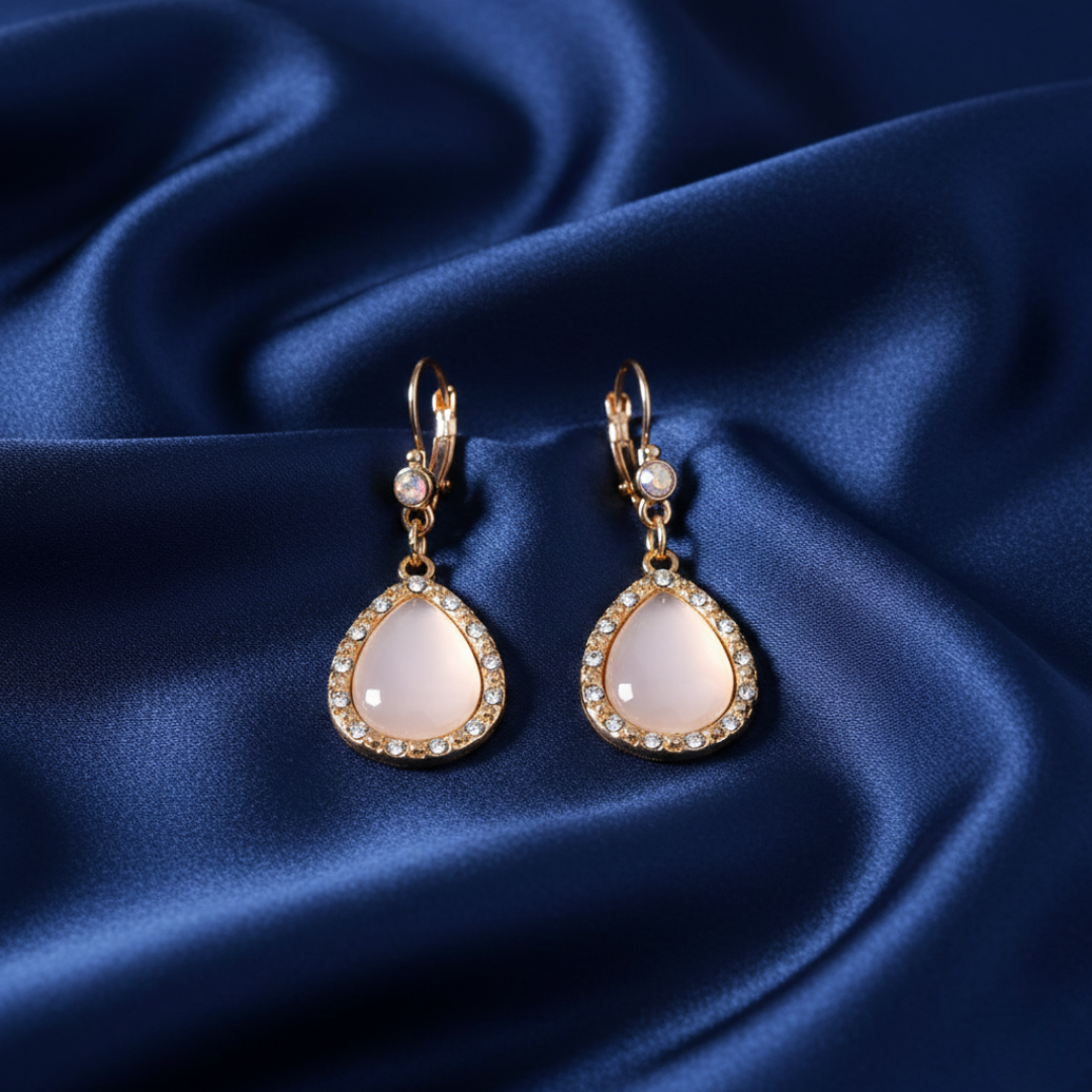 Light Pink Moonstone Euro Crystal Drop Earrings on dark blue satin 
