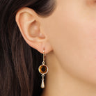 Close up of a woman wearing Golden Topaz Channel Crystal Pear Drop Earrings
