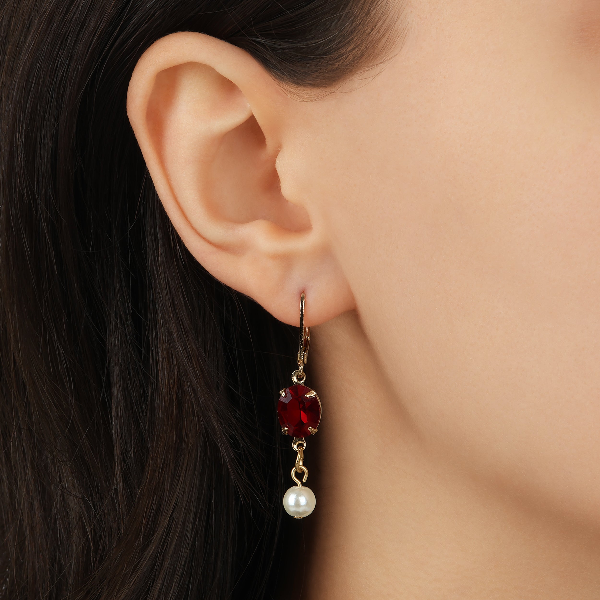 Close up of a woman wearing Oval Siam Red Crystal & Pearl Bead Drop & Dangle Earrings