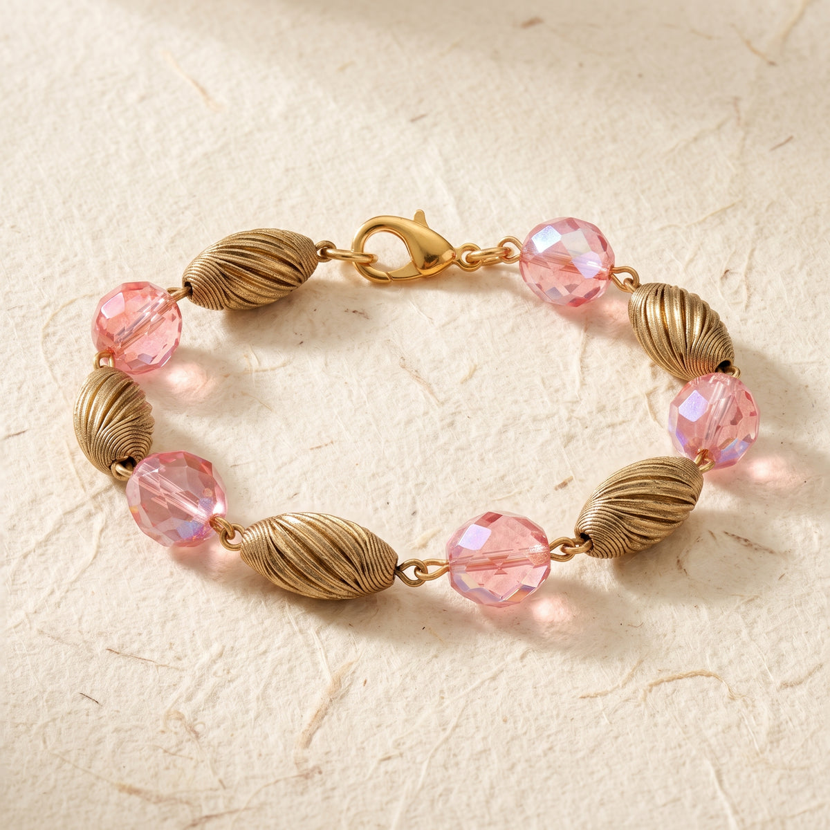 Light Rose Pink AB Crystal & Gold Corrugated Bead Bracelet on handmade cotton paper 