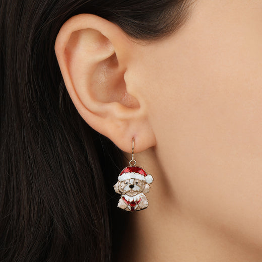 Close-up of a model wearing our Christmas Puppy Drop Earrings
