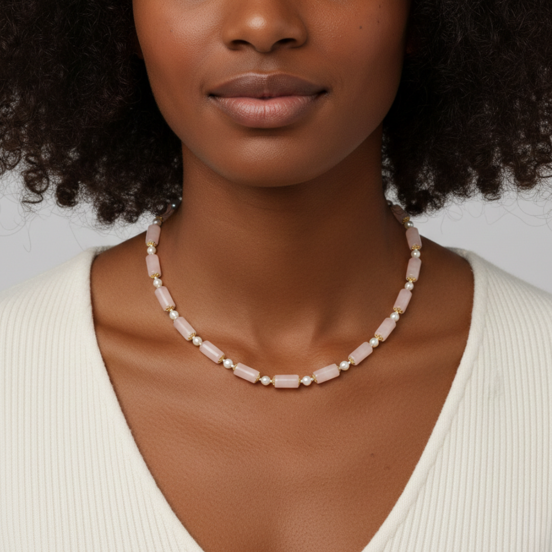 Woman wearing a pearl necklace against a neutral background