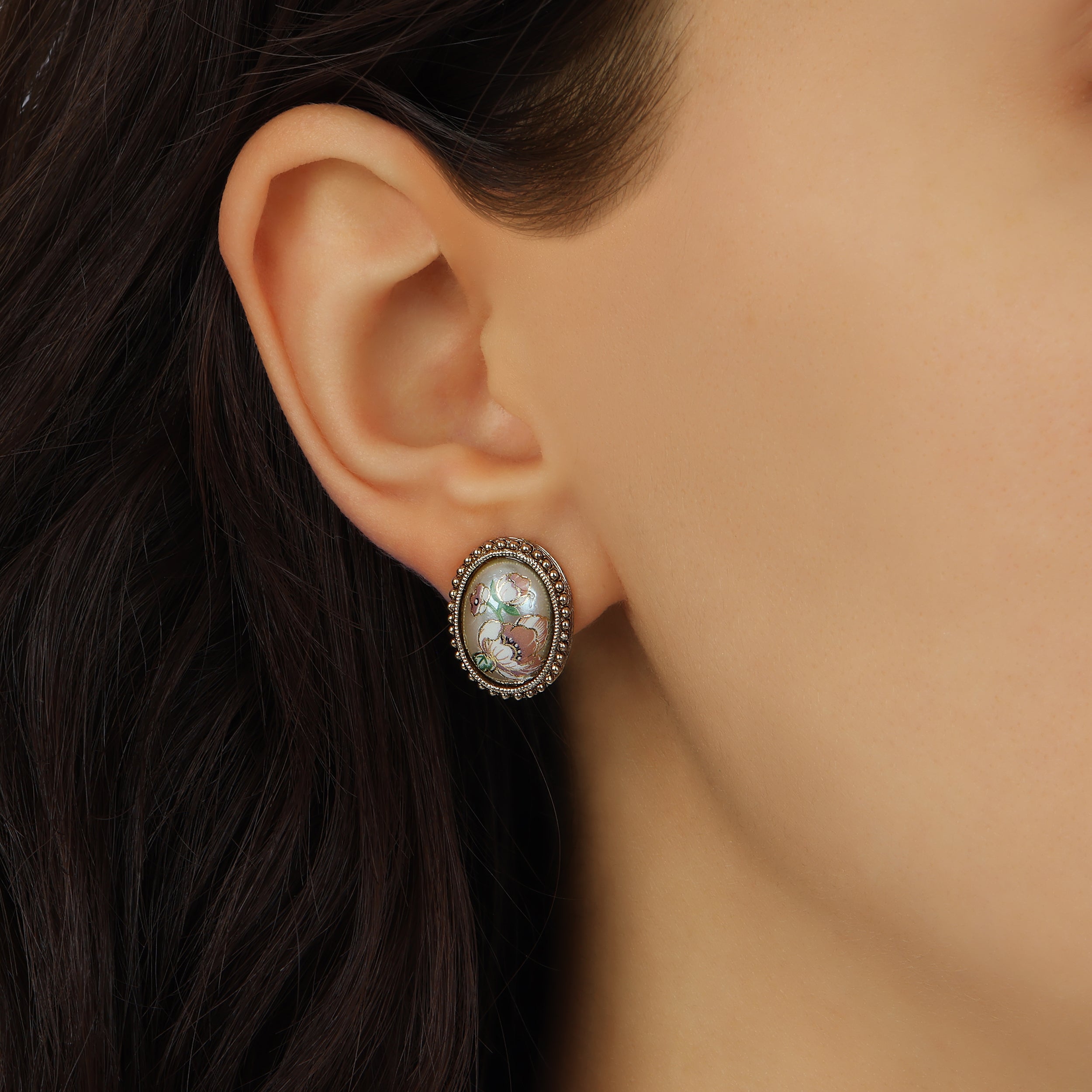 Close up of a woman wearing Pink Floral Oval Faux Pearl Stud Earrings