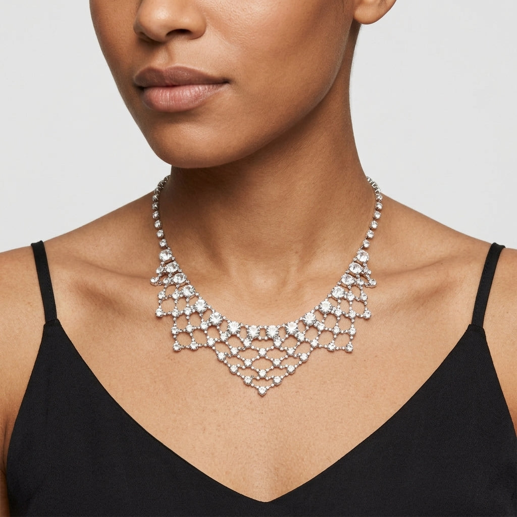 Woman wearing a sparkling Austrian crystal lattice necklace against a neutral background