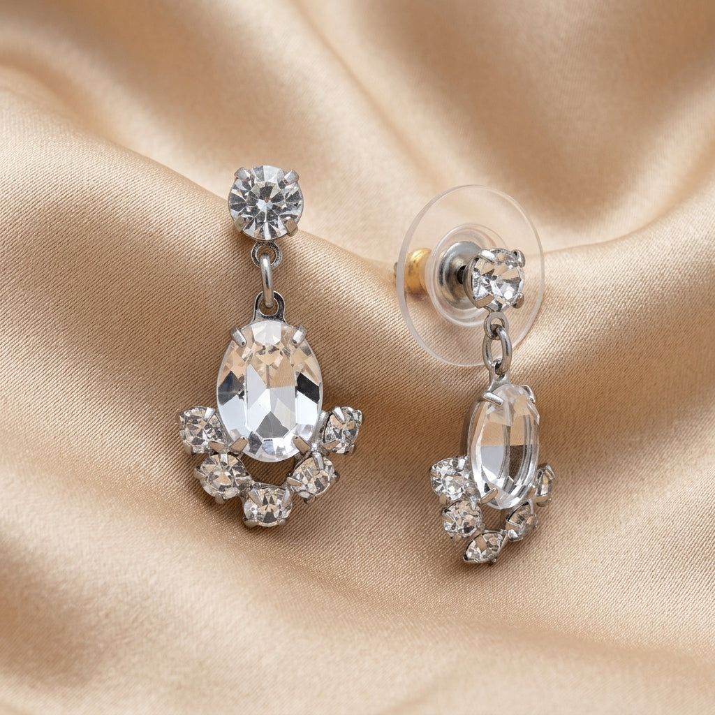 Oval & Round Austrian Crystal Vintage Post Stud Earrings resting on champagne silk