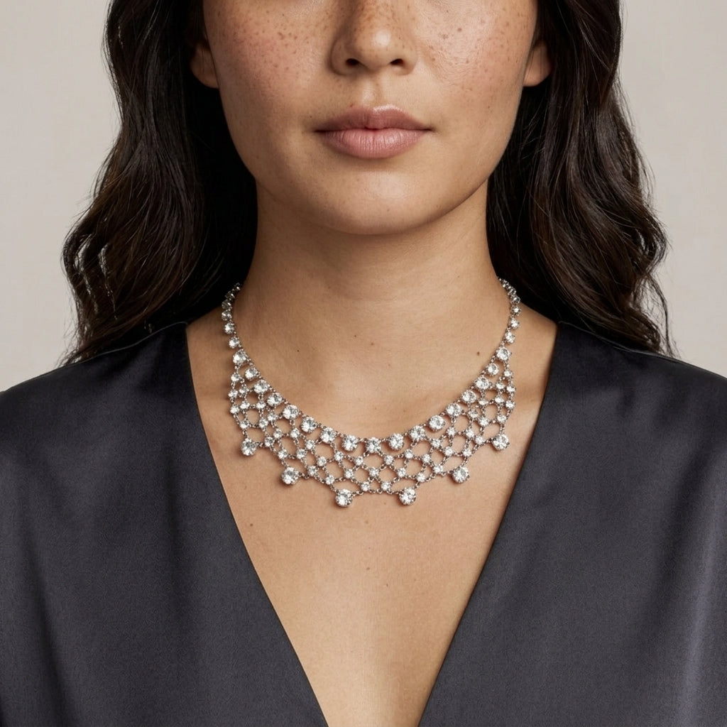 Woman wearing a sparkling Austrian crystal lattice necklace against a neutral background
