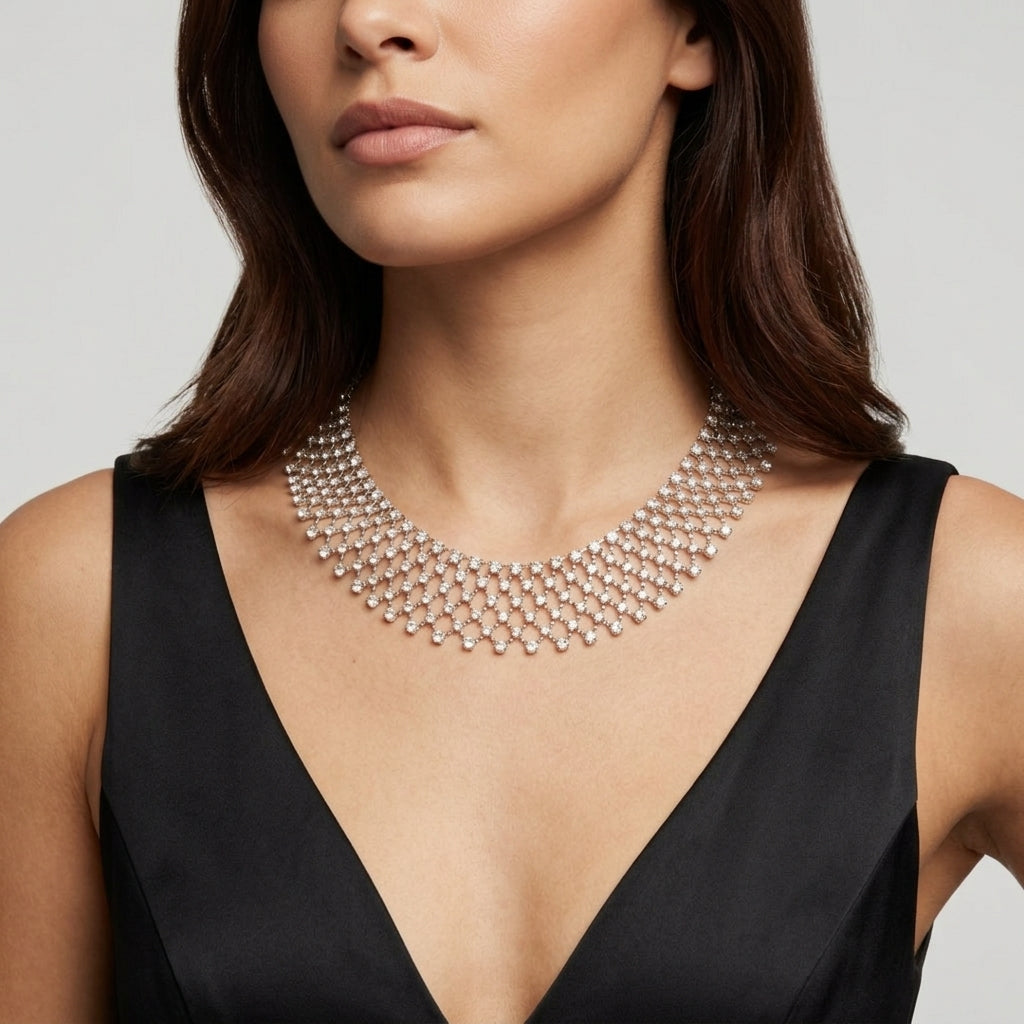 Woman wearing a sparkling Austrian necklace against a neutral background