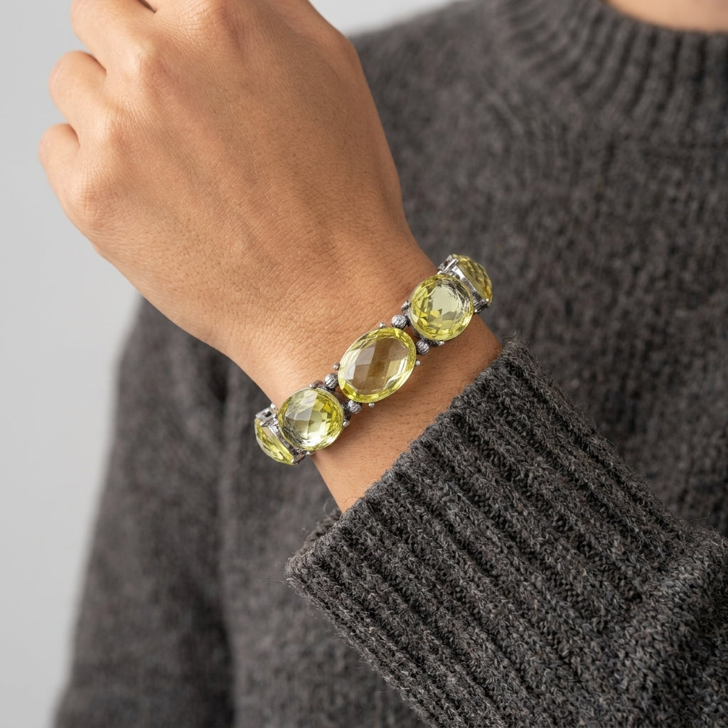 Light Yellow Crystal Oval Faceted Stretch Bracelet worn by a wrist model with a gray sweater