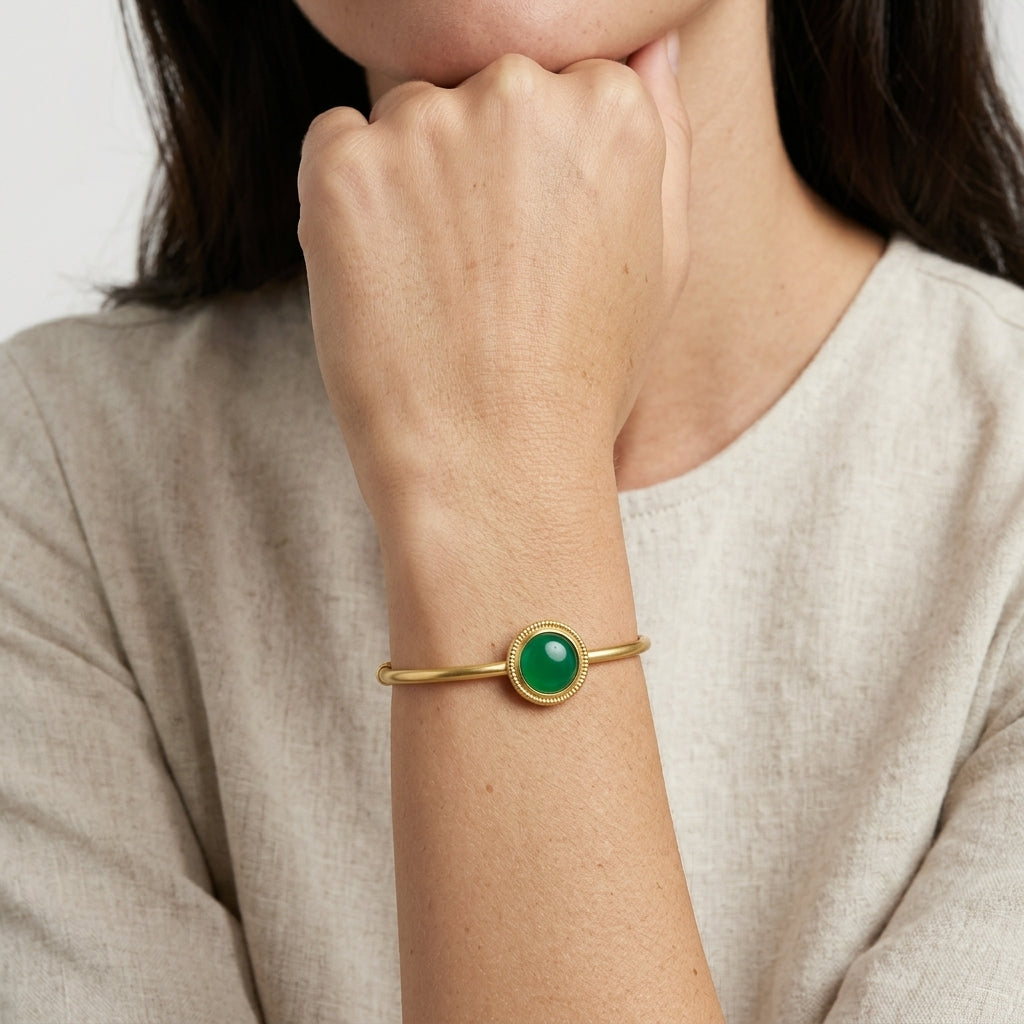 Woman wearing a Jade Gemstone Golden Spring Hinge Bracelet on her wrist