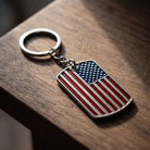 American Flag Dog Tag Key Chain on a wooden surface