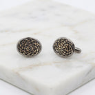 Eclipse Black And Gold Chain Cufflinks resting on white marble stone