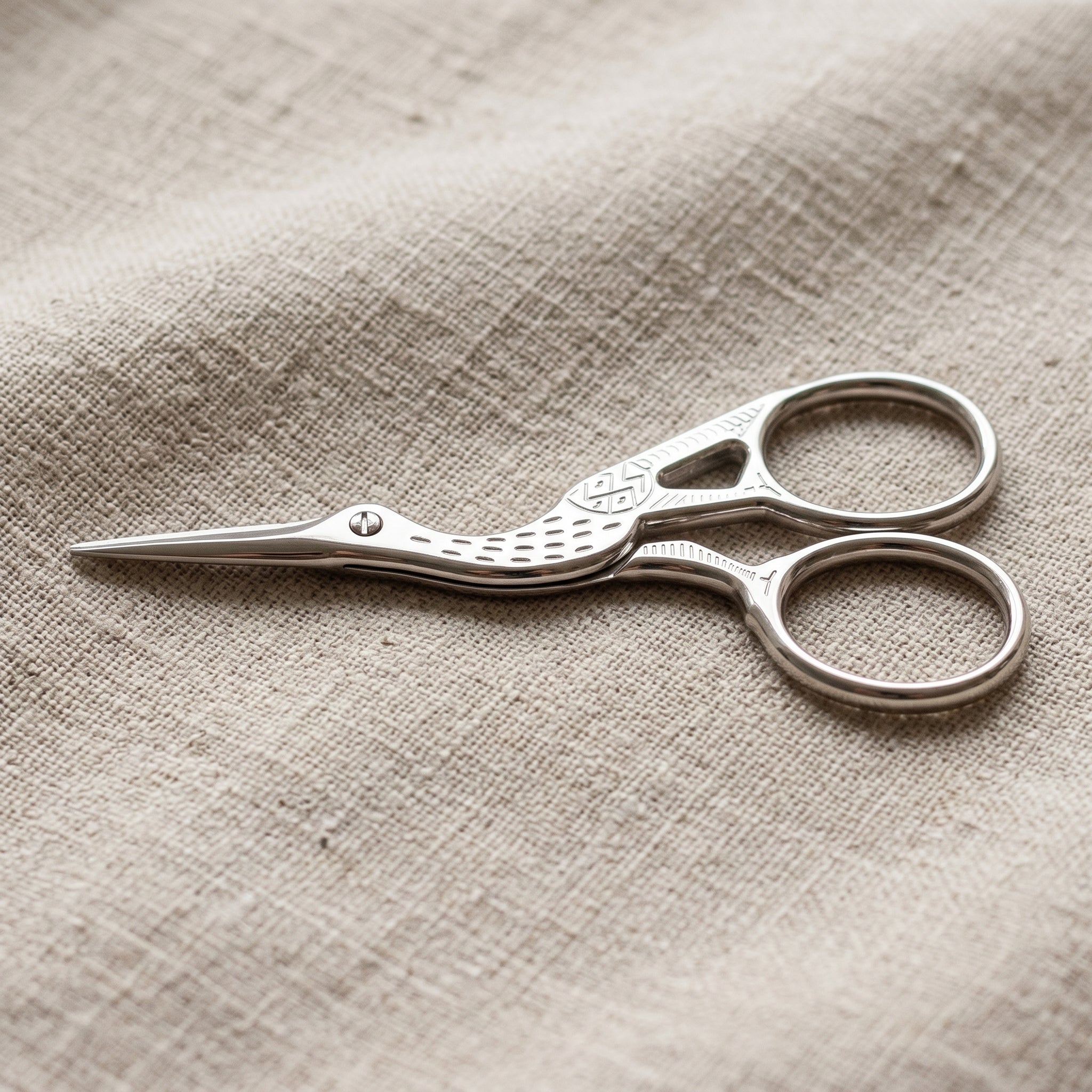 Embroidery Crane Bird Scissors on light colored linen