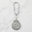 March Crystal Flower of The Month Carabiner Key Chain resting on marble surface