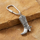 Pewter Cowboy Boot Carabiner Key Chain  on a stone surface