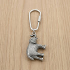 Pewter Elephant Key Ring on a wooden surface