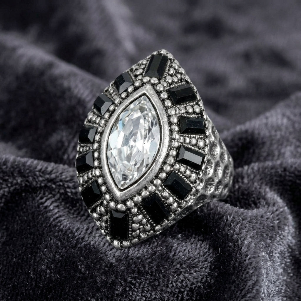 Honora Hammered Jet Black & Clear Crystal Ring on a textured gray fabric