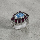 Honora Hammered Purple & Light Sapphire Crystal Ring  on a gray cement surface