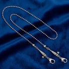 Silver tone Baseball & Bat Chain Mask Holder on blue fabric