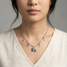 Woman wearing a silver LOVE Antiqued Cat Pendant Necklace