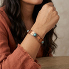 Person wearing a Round Turquoise Stone Bangle Bracelet