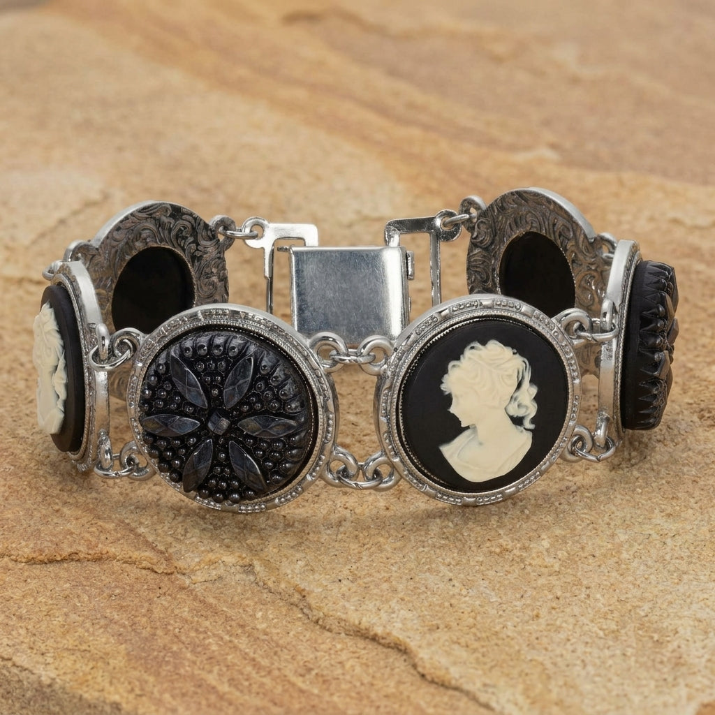 Black Floral Glass Stone & Cameo Clasp Bracelet on a light stone surface