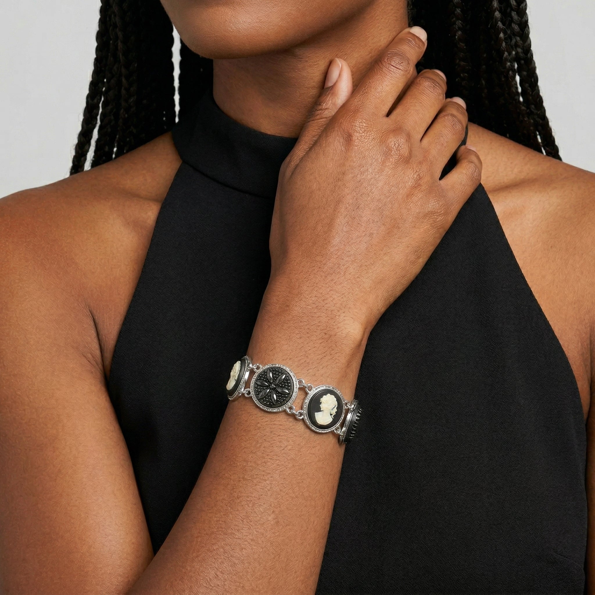 Woman wearing a black dress with a Black Floral Glass Stone & Cameo Clasp Bracelet
