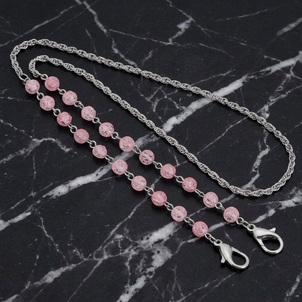 Pink Beaded Face Mask Chain Holder on a black marble surface