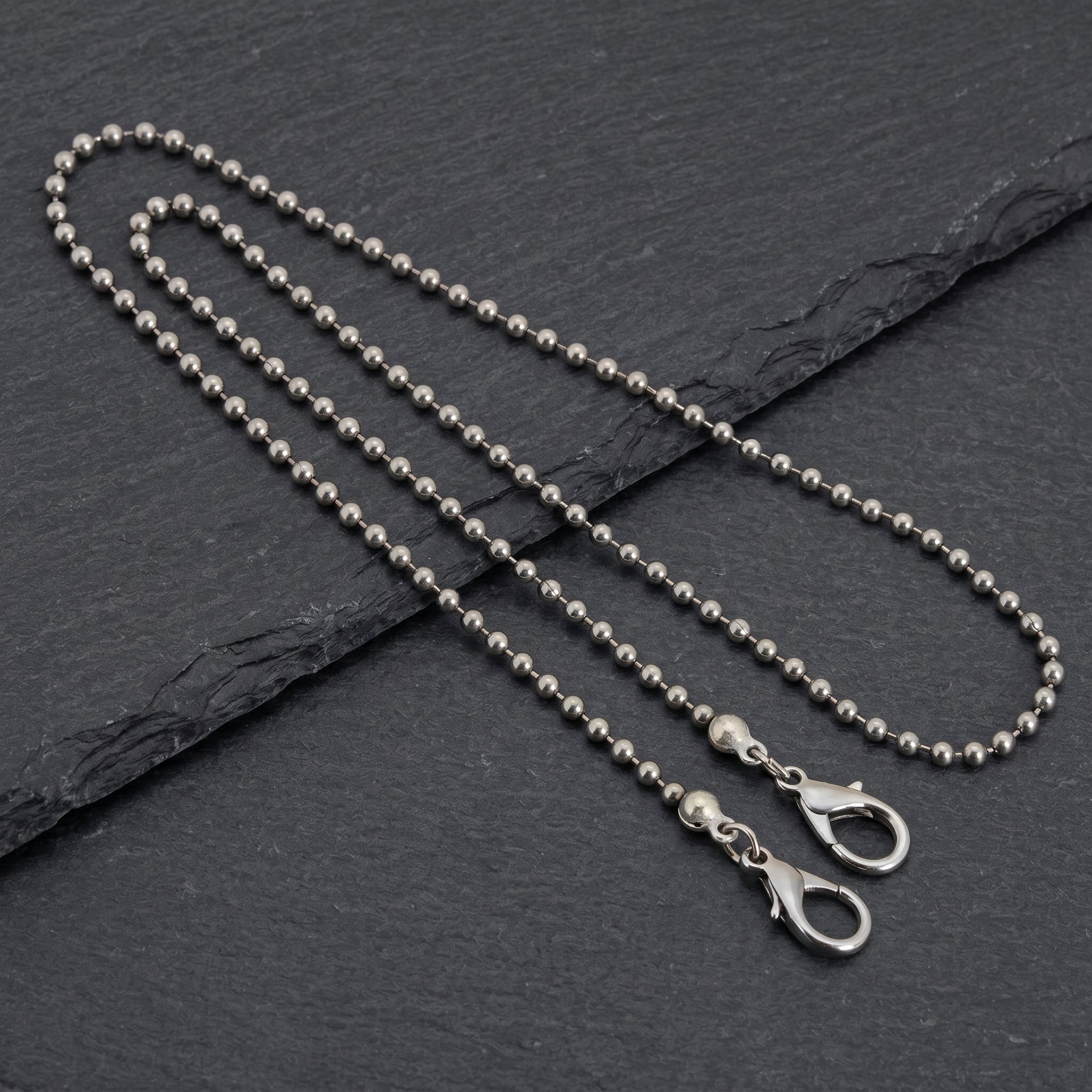 Stainless Steel 3.2mm Ball Chain Mask Holder on black stone surface