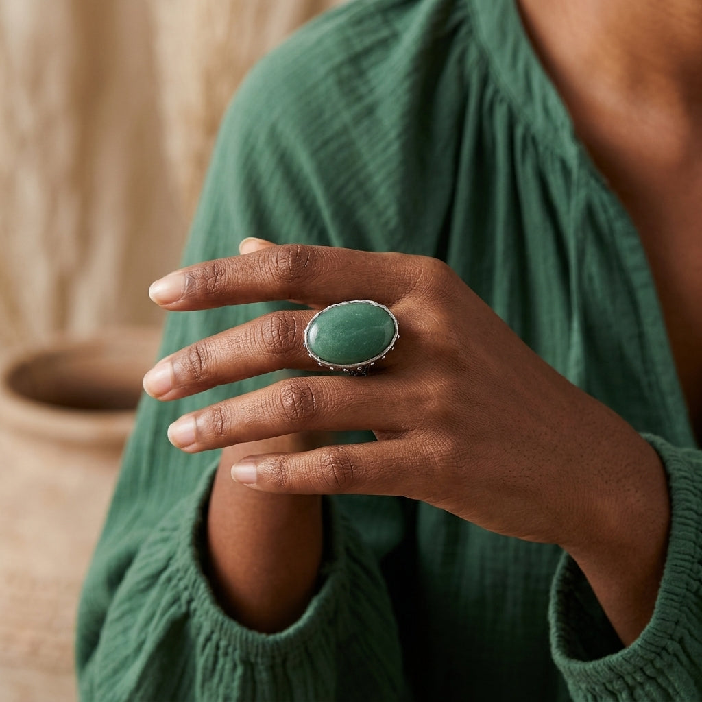 Woman in a green outfit wearing a Green Aventurine Gemstone Austrian Crystal Oval Ring